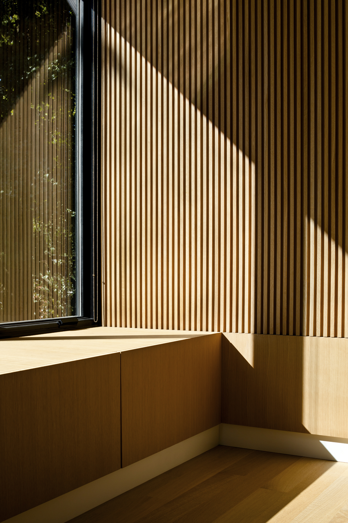 Wood Lined walls in modern primary bedroom suite