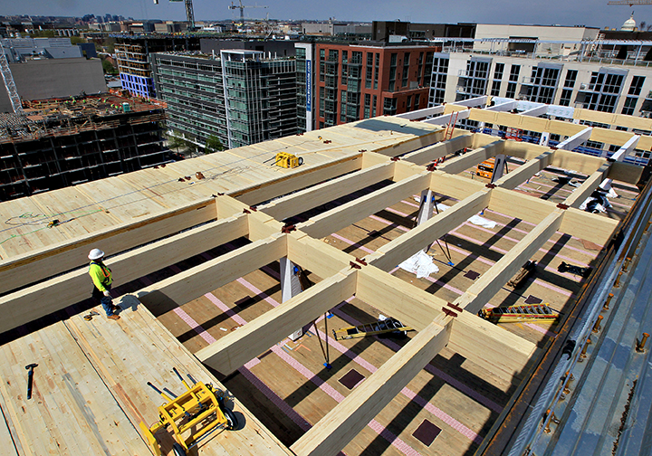 80 M Street SE Mass Timber Installation. Photo by Maurice Harrington, Sisson Studios, Inc. Image of a rooftop under construction
