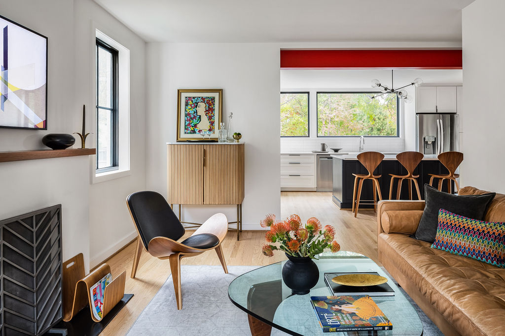 Modern Twist on a Traditional Home - Interior living room area that flows into the kitchen